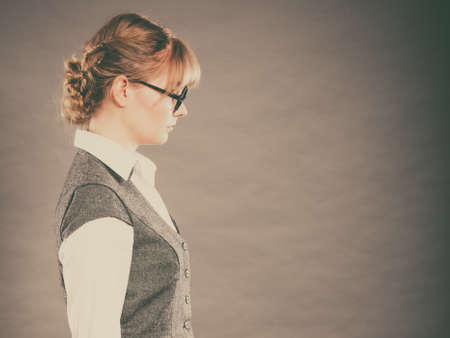 Profile of elegant young businesswoman. Sad secretary cautioned reprimanded by boss. Woman white...