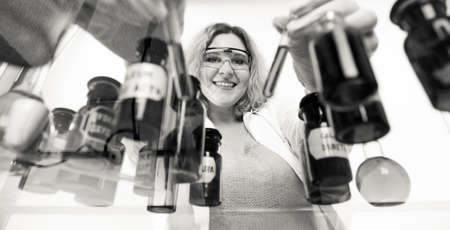 Experiment, research in progress. Chemist woman or student girl, laboratory assistant or scientific...