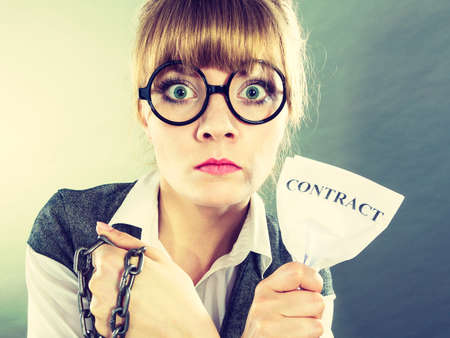 Businesswoman woman ending agreement deal. Young girl holding chain breaking free creasing squeezing...