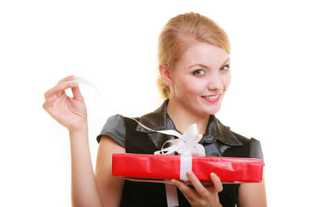 Holidays love and happiness concept - beautiful blonde girl with red gift box isolated