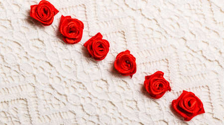 valentines day wedding, invitation or greeting card. red decorative satin rose flowers on white...
