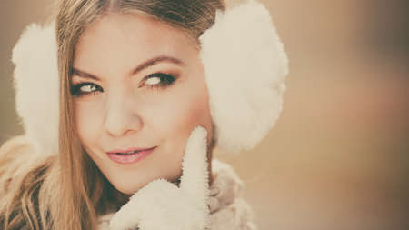 Portrait of pretty fashionable woman in fall forest park. Suspicious gorgeous young girl in white...