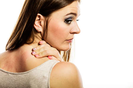 Health problem. Young woman scratching her itchy back with allergy rash isolated on white