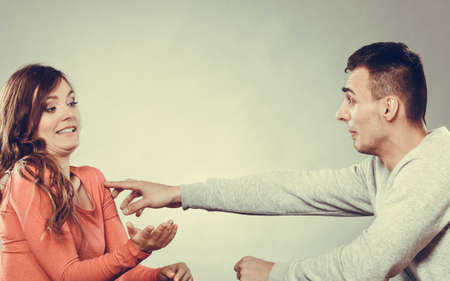 Happy couple having fun and fooling around. Joyful man and woman have nice time. Guy touching girl. Good relationship. の写真素材