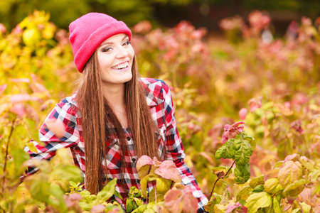 Fall lifestyle concept, harmony freedom. Beauty young woman fashion girl casual style relaxing walking in autumnal park, outdoorの写真素材