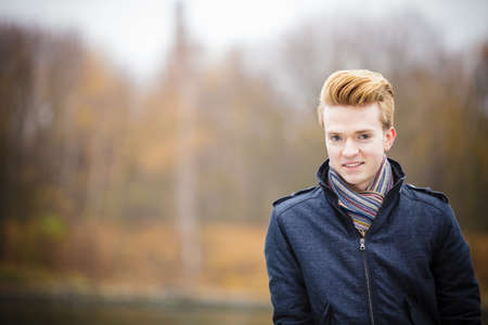 Fall season and people concept. Portrait of young stylish fashionable man in jacket.の写真素材