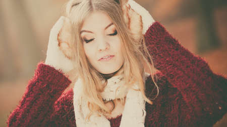 Portrait of pretty attractive relaxed fashionable woman in fall forest park. Gorgeous young girl in...