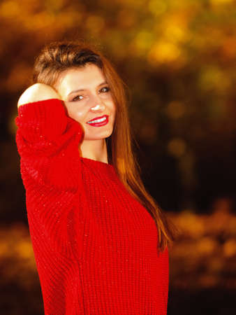 Fall lifestyle concept, harmony freedom. Beauty young woman portrait, fashion girl relaxing walking in autumnal park, outdoor sunny dayの写真素材