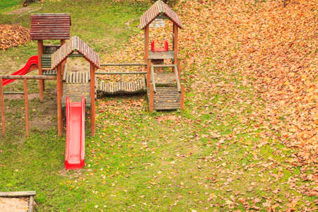 Empty playground playpark in fall autumn season. Tranquil outdoor scene.の写真素材