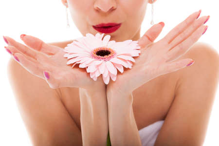 Wedding day. Closeup attractive romantic girl bride with pink flower gerbera daisy isolated on white backgroundの写真素材