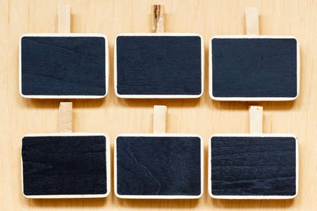small blackboards slate chalk boards with space for text menu on wooden surface, empty blank signの写真素材