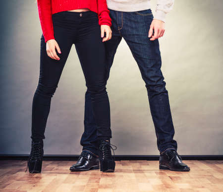 Romantic couple in love. Legs of woman and man. Feet in footwear shoes indoorの写真素材