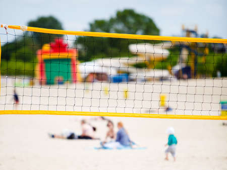 Volleyball summer sport equipment. Closeup of net netting wire on a sandy beach outdoor. Active lifestyle.の写真素材