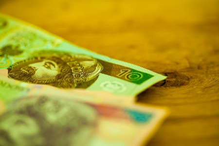 Money and savings concept. Polish zloty banknotes currency on table,  with shallow depth of field