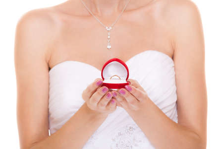 Engagement ring box in bride hands. Closeup of woman palms holding jewellery.の写真素材