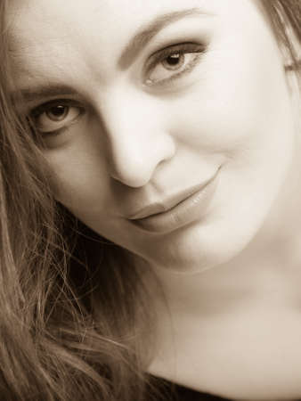 Seductive sexy gorgeous woman wearing lingerie in bed at home. Attractive sensual young girl with long hair. Female underwear fashion. Black and white.の写真素材