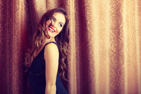 Sensuality and fashion. Young seductive sexy attractive woman in lingerie curtains indoors.