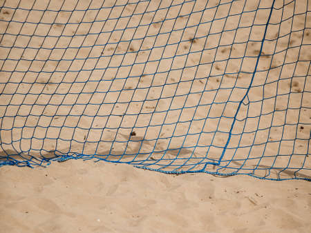 Football summer sport. closeup goal net on a sandy beach outdoor. active lifestyleの写真素材
