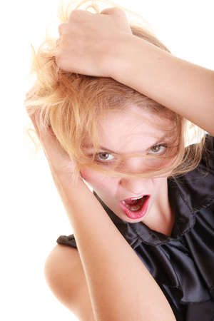 Angry businesswoman crazy boss furious woman screaming and pulling messy hair isolated on white. Stress and negative emotions.の写真素材