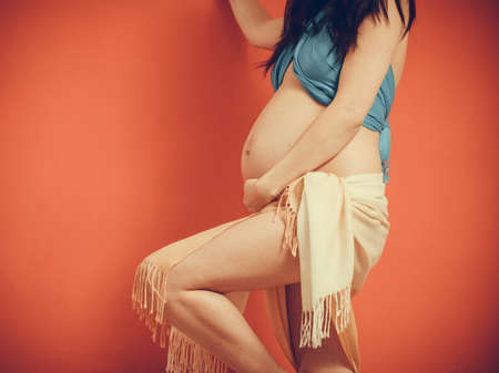 New life concept. Pregnancy, motherhood and happiness. Closeup on tummy of pregnant woman.の写真素材