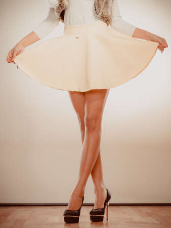 Female fashion. Closeup black high heels spiked fashionable shoes on sexy female legsの写真素材