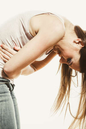 Woman suffering from stomachache pain. Girl having period bellyache. Health.