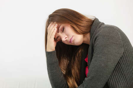 Very paintful headache. Unhealthy woman in pain. Sharp strong sore.
