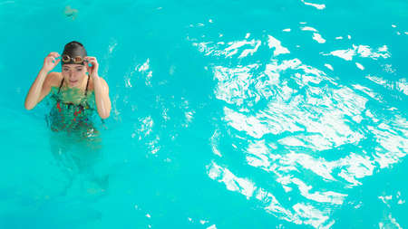 Woman athlete in swimming pool water. Water sport comptetition exercise. Human swimmer training.の写真素材