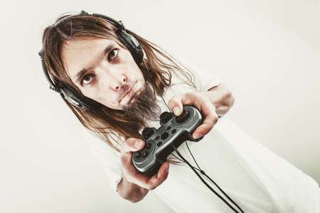 Lifestyle of young people. Student man spending time on playing games videogames console  . Long...