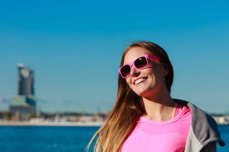 Beauty resting woman outdoor. Happy traveller girl spending time on fresh air. Holiday and vacation.
