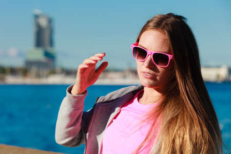 Beauty resting woman outdoor. Attractive traveller girl spending time on fresh air. Holiday and vacation.の写真素材
