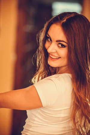 Portrait of happy cute pretty gorgeous woman. Attractive young girl with long hair wearing white...