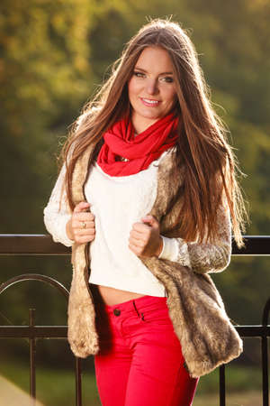 Fall lifestyle concept, harmony freedom. Beauty young woman fashion girl relaxing walking in autumnal park, outdoorの写真素材