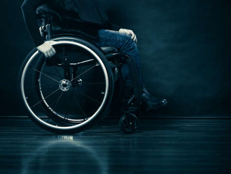 Real people, disability and handicap concept. Young woman invalid girl sitting on wheelchair part of...