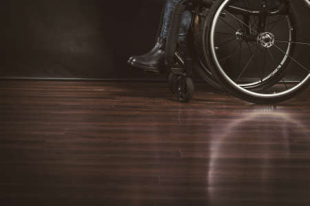 Depressed person on wheelchair. Disabled human. Disability sadness health rehabilitation concept.の写真素材