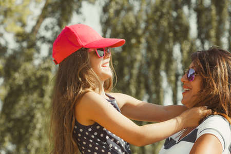 Love and good feelings in family. Childhood and parenthood concept. Lovely cute girl and woman in summer holidays. Adorable mommy and her child daughter together.の写真素材