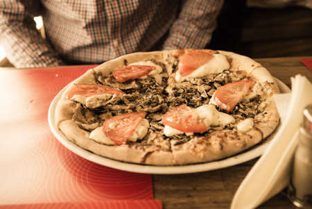 Delicious fresh pizza on table in restaurantの写真素材