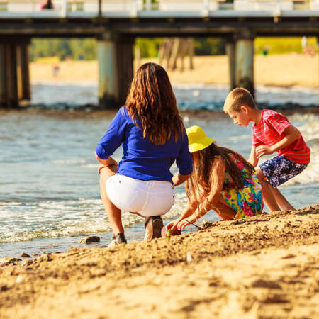 Summer holidays and common travel. Lovely happy active family on vacation trip. Relatives spending enjoyable good time together.の写真素材
