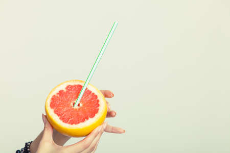 Summer healthy fruit drink. Juice from grapefruit citrus. Care about health.の写真素材