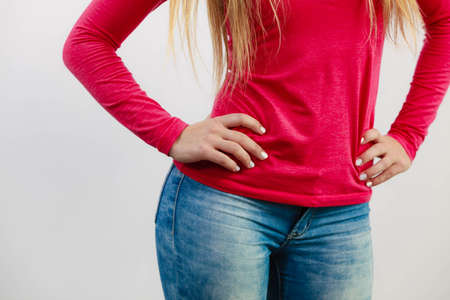 Woman with hands on hips. Female body part. Fashion health  leisure feminine concept.の写真素材