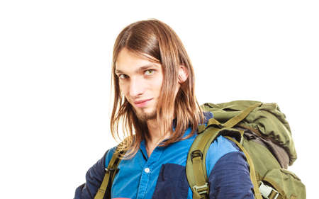 Portrait of man tourist backpacker on trip. Young guy hiker backpacking. Summer vacation travel....