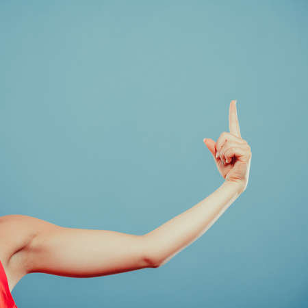 Human hand showing blank empty copyspace on blue. Advertisement.の写真素材