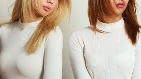 Corpus ladies people concept. Shot of part of body. Picture presents womens chest wearing white top.の写真素材