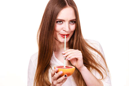 Woman attractive long hair girl colorful eyes makeup holding grapefruit citrus drinking juice from...
