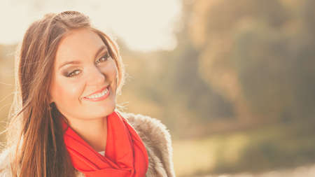 Fall lifestyle concept, harmony freedom. Beauty young woman fashion girl relaxing walking in autumnal park, outdoorの写真素材