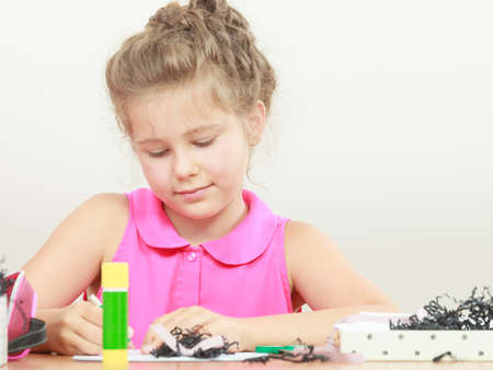 Little girl draw in the classroom. Being creative in elementary ageの写真素材