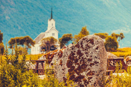 Mountain landscape and the white wooden Oppstryn Church in Stryn Municipality in Sogn og Fjordane county, Norway.の写真素材