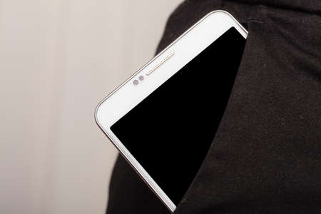 Technology and modern portable new generation. Smartphone in trousers pocket mobile phone business...