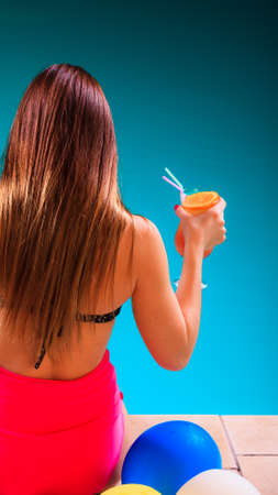 Spa relax and holidays concept. Young woman long hair  in swimsuit back view. Fit female body, girl...