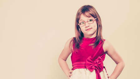 Charming little girl in beauty princess dress. Smiling lovely cute female child.の写真素材